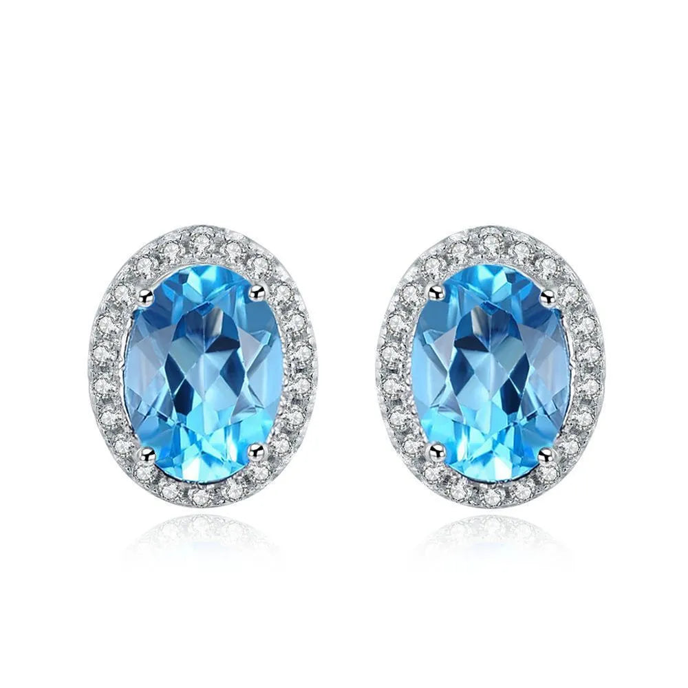 925 sterling silver jewellery set with blue topaz stones including geometric earrings, necklace, ring and pendant