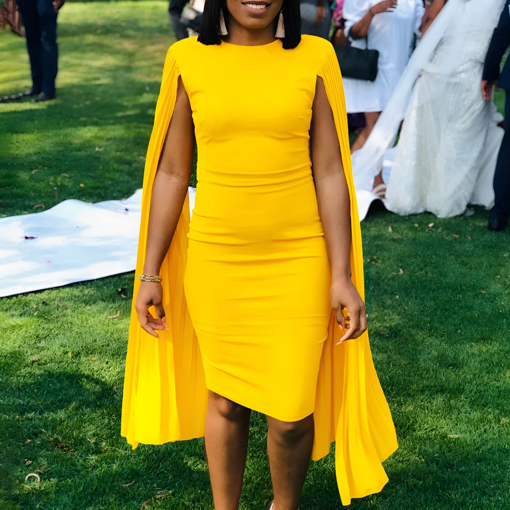 Round neck high waist evening gown with long sleeves and a pleated shawl in yellow, orange, red, or green.