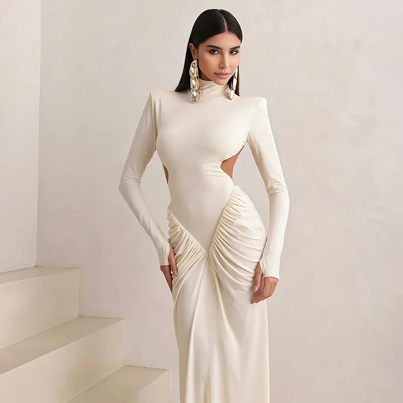 Long sleeve high collar slim fit pleated backless dress in a solid colour on a model.