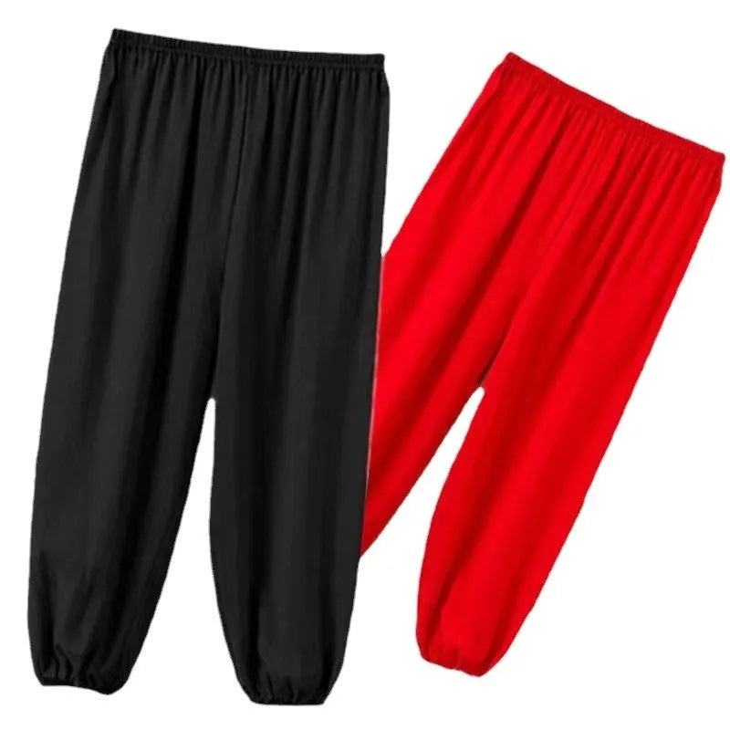 Children's black high-elasticity Lycra practice pants for martial arts training with Asian sizing.