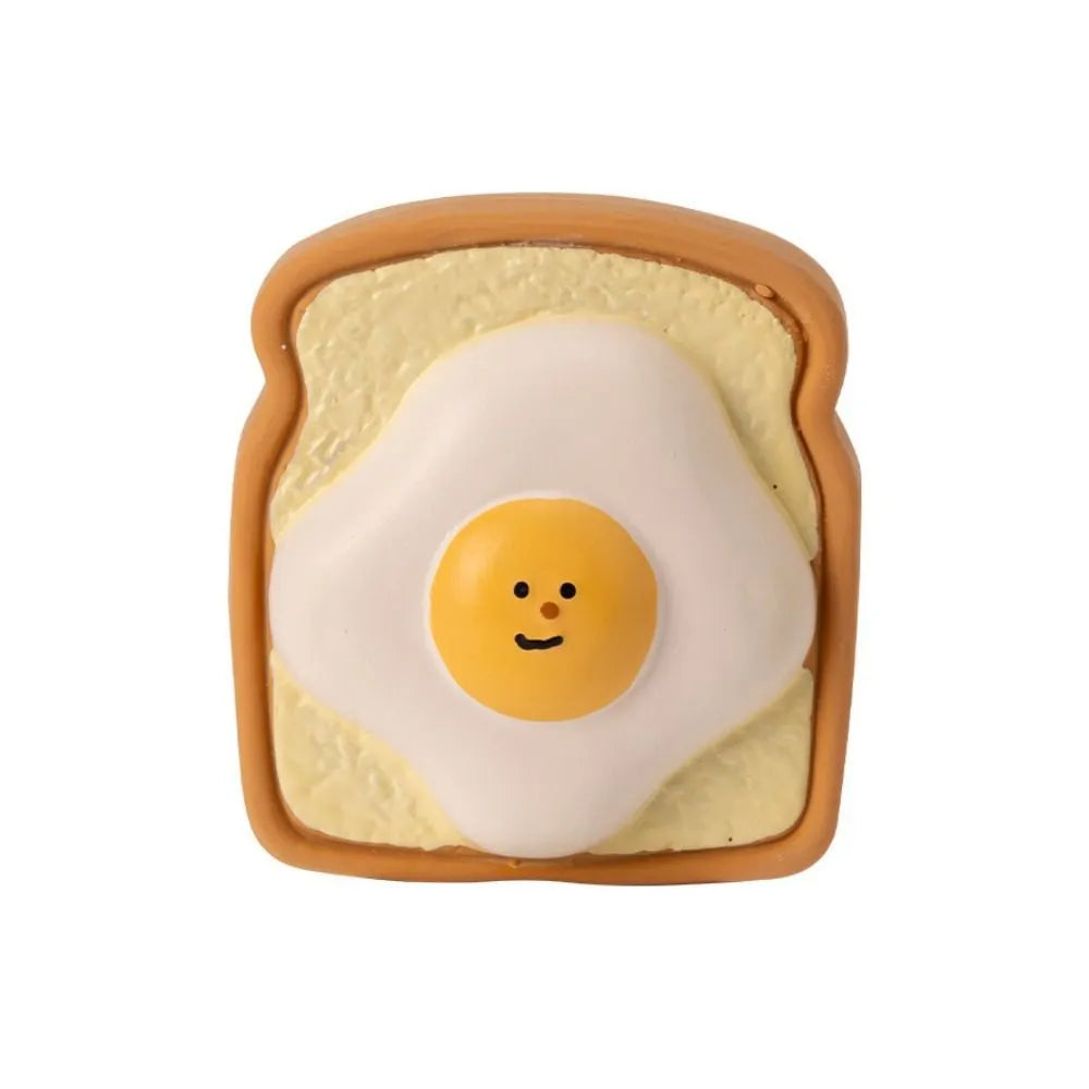 Cartoon pattern latex dog chew toy shaped like bread with egg in yellow and green colours