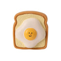 Cartoon pattern latex dog chew toy shaped like bread with egg in yellow and green colours