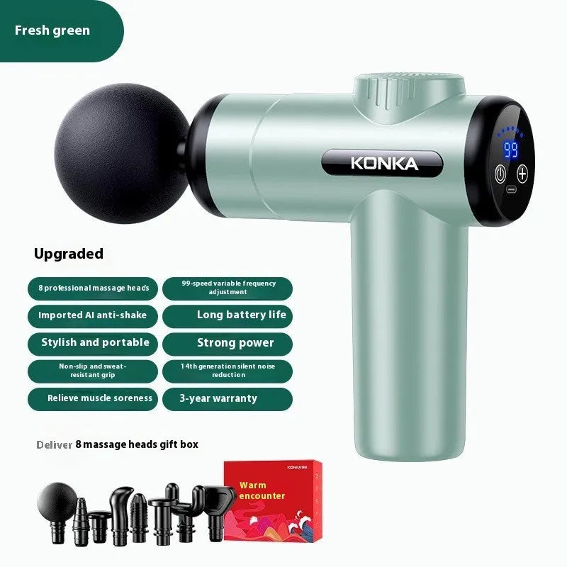 Konka professional electric mini massage gun in grey colour with multiple massage head attachments on a table.