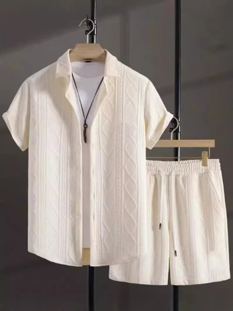 Man wearing a beige jacquard short sleeve suit jacket with matching shorts.
