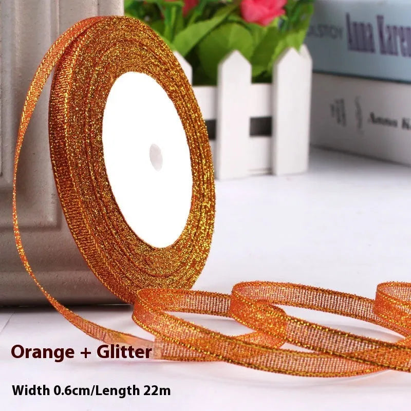 Roll of 0.6cm wide polyester gift ribbon in various colours including gold leaf, coffee and sky blue options