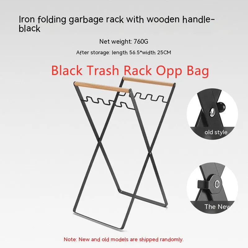 Black iron folding trash storage rack with wooden handle mounted on a wall.
