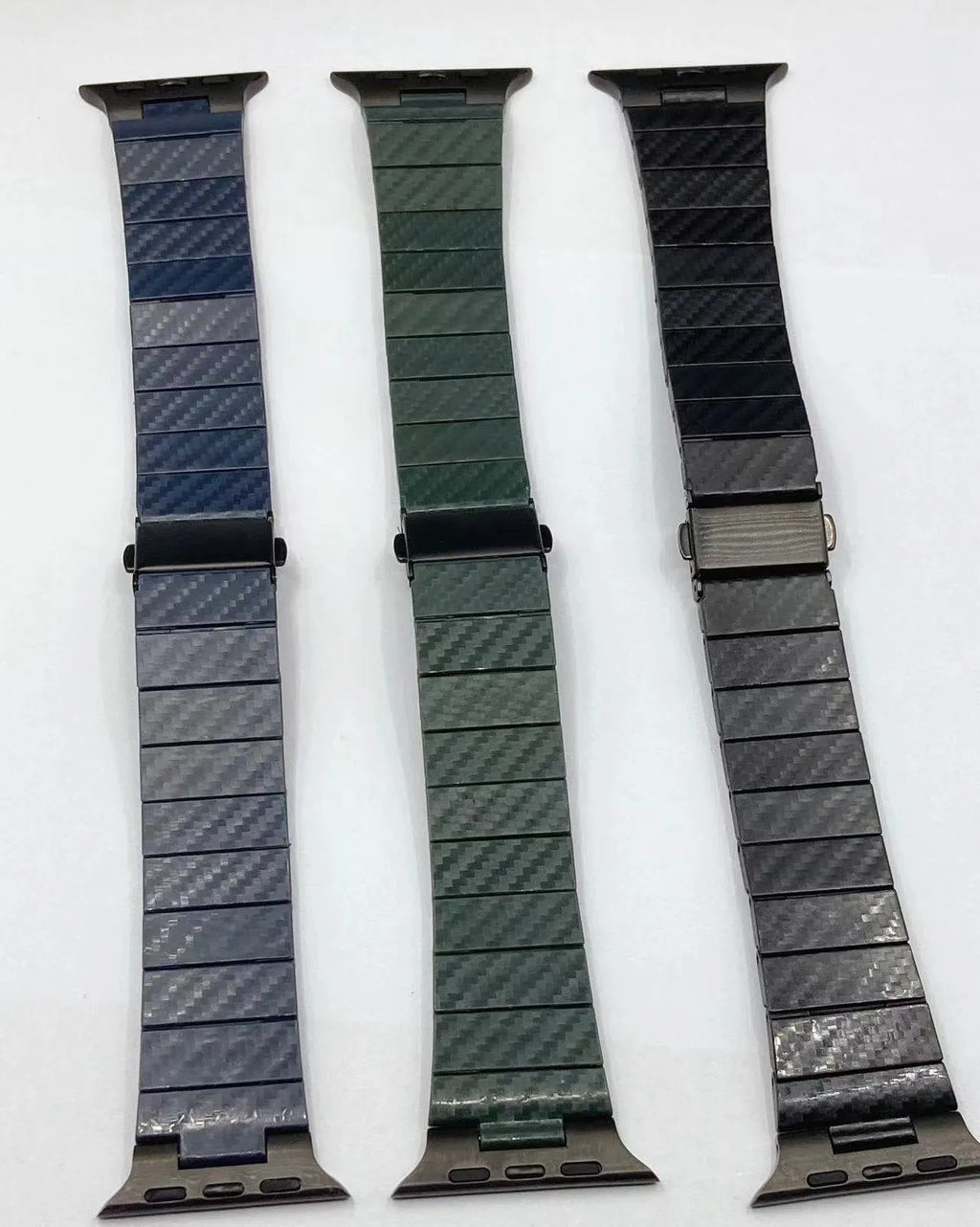 Black carbon fiber watch band for Apple Watch showing chain links and metal clasp on a white background