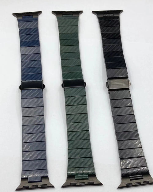 Black carbon fiber watch band for Apple Watch showing chain links and metal clasp on a white background