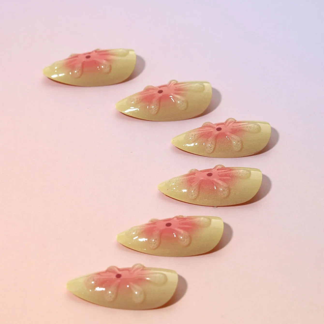 Simple fake nails set with 3D cartoon flowers, jelly glue, and a nail file on colour TY-318.