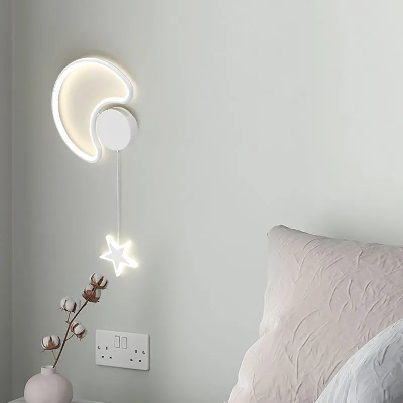 Five-pointed star shaped bedside wall lamp with cloud motif in black finish mounted beside bed