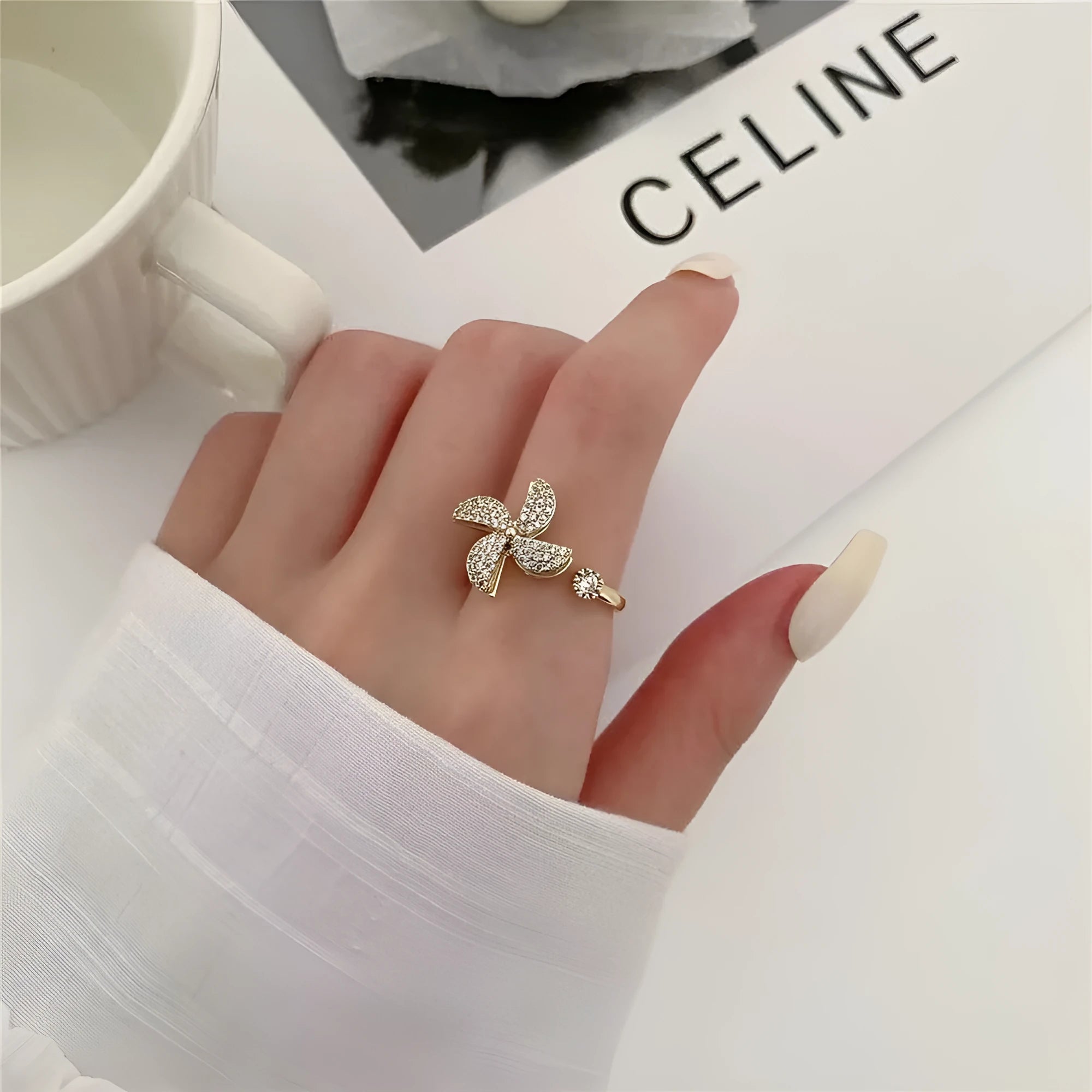 Rotating copper ring with geometric windmill design in gold or silver electroplate