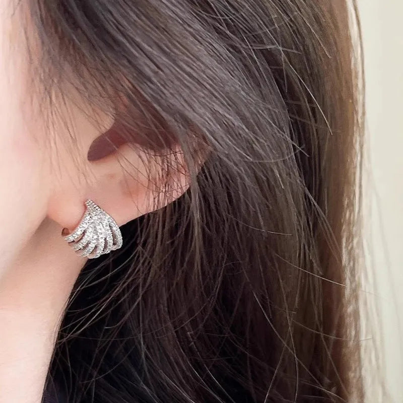 Women's platinum electroplated geometric earrings with line design and zircon details