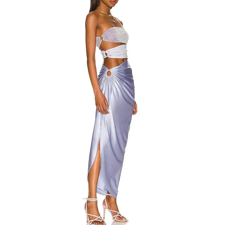 Purple one-piece swimsuit with a separate matching wrap skirt laid flat.