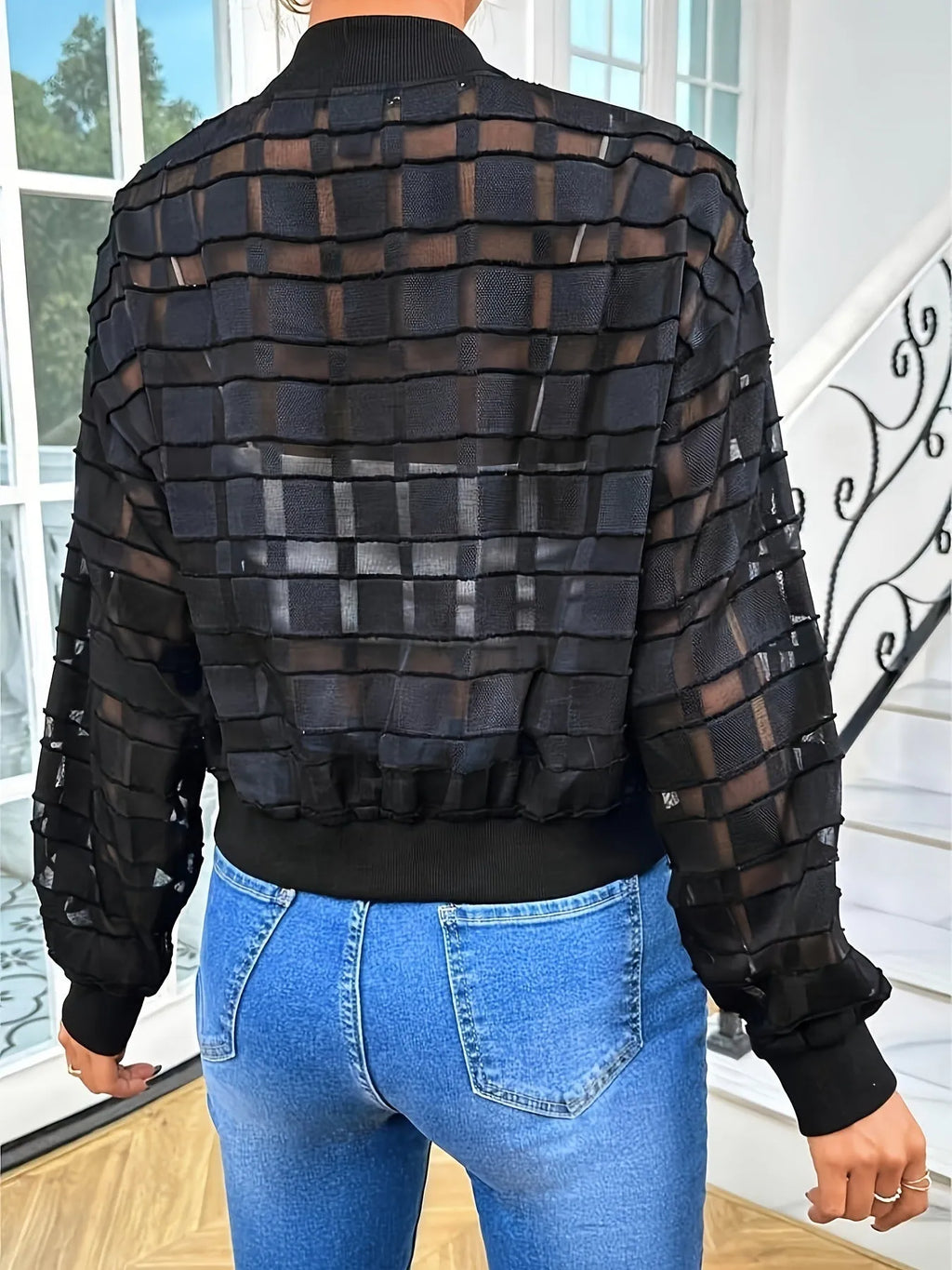 Black women's casual jacket with geometric pattern and front zipper.