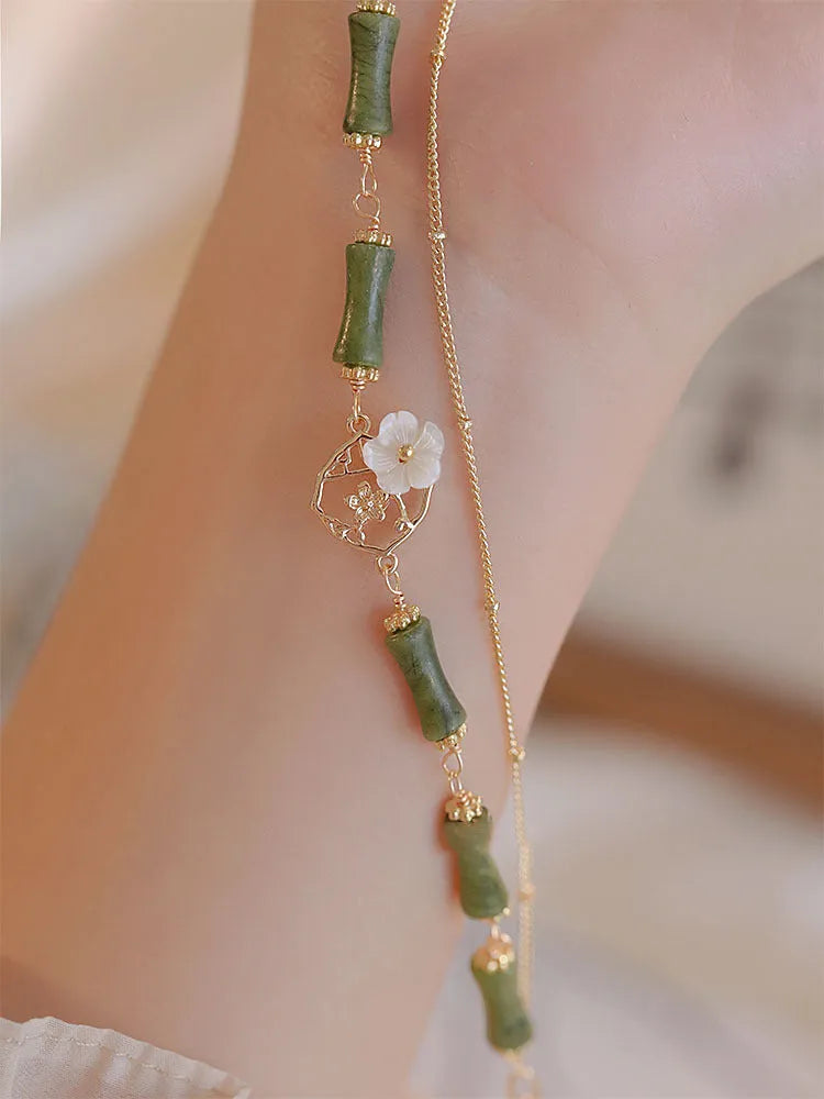 Natural olivine stone bracelet with Chinese double layer design and Bells of Ireland charms