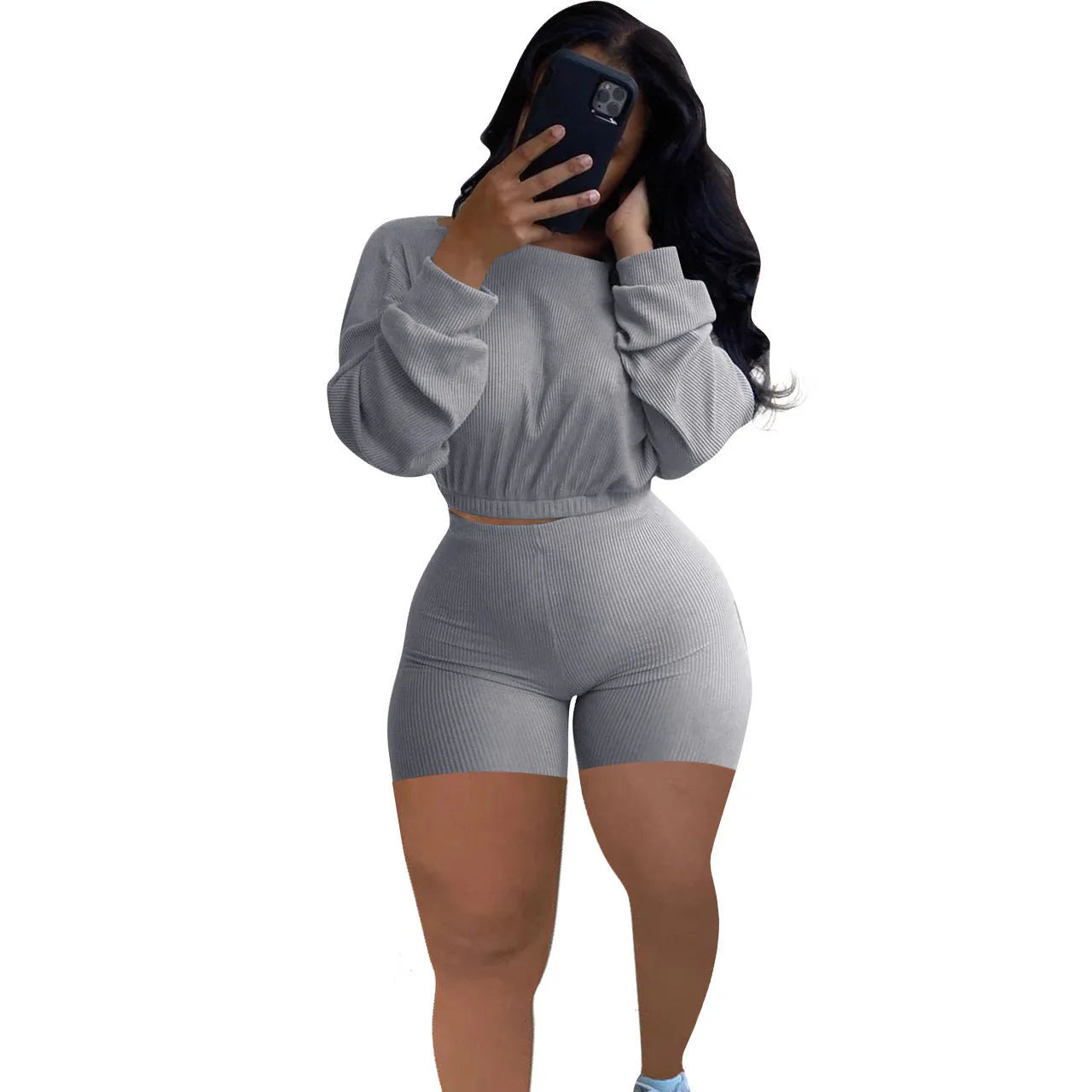 Sunken stripe solid colour off-the-shoulder long sleeve top and shorts two-piece set on a hanger.
