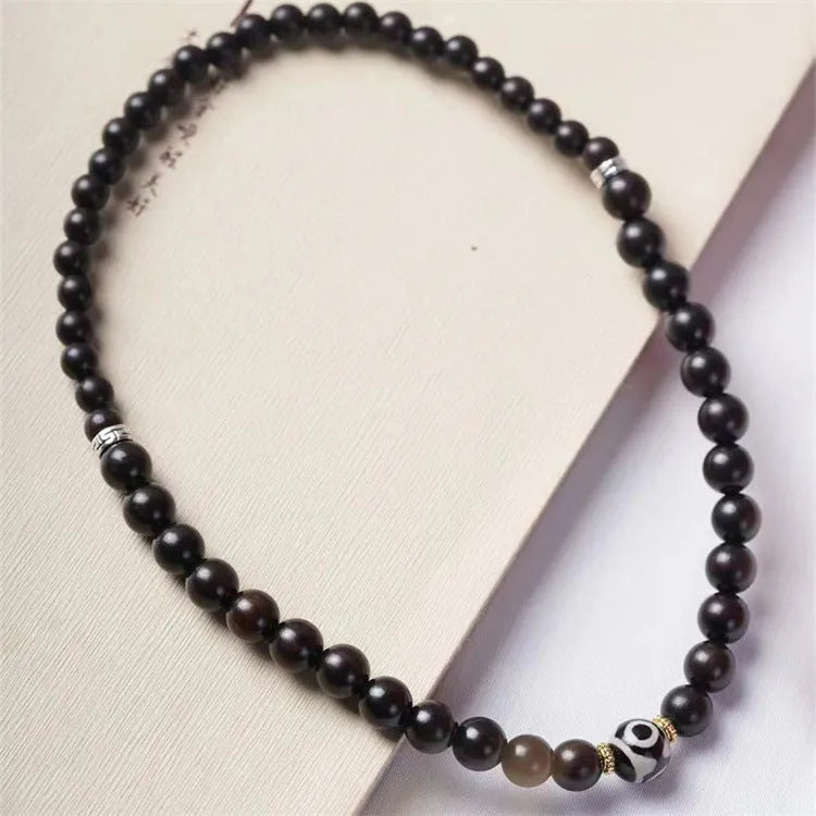 Ebony bracelet with Tibet beads design showing two-tone colour circles and 8mm diameter