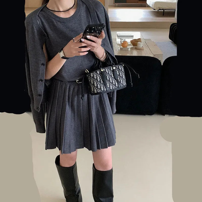 Women's grey knitted two-piece set with vest skirt and long-sleeved cardigan in art retro style