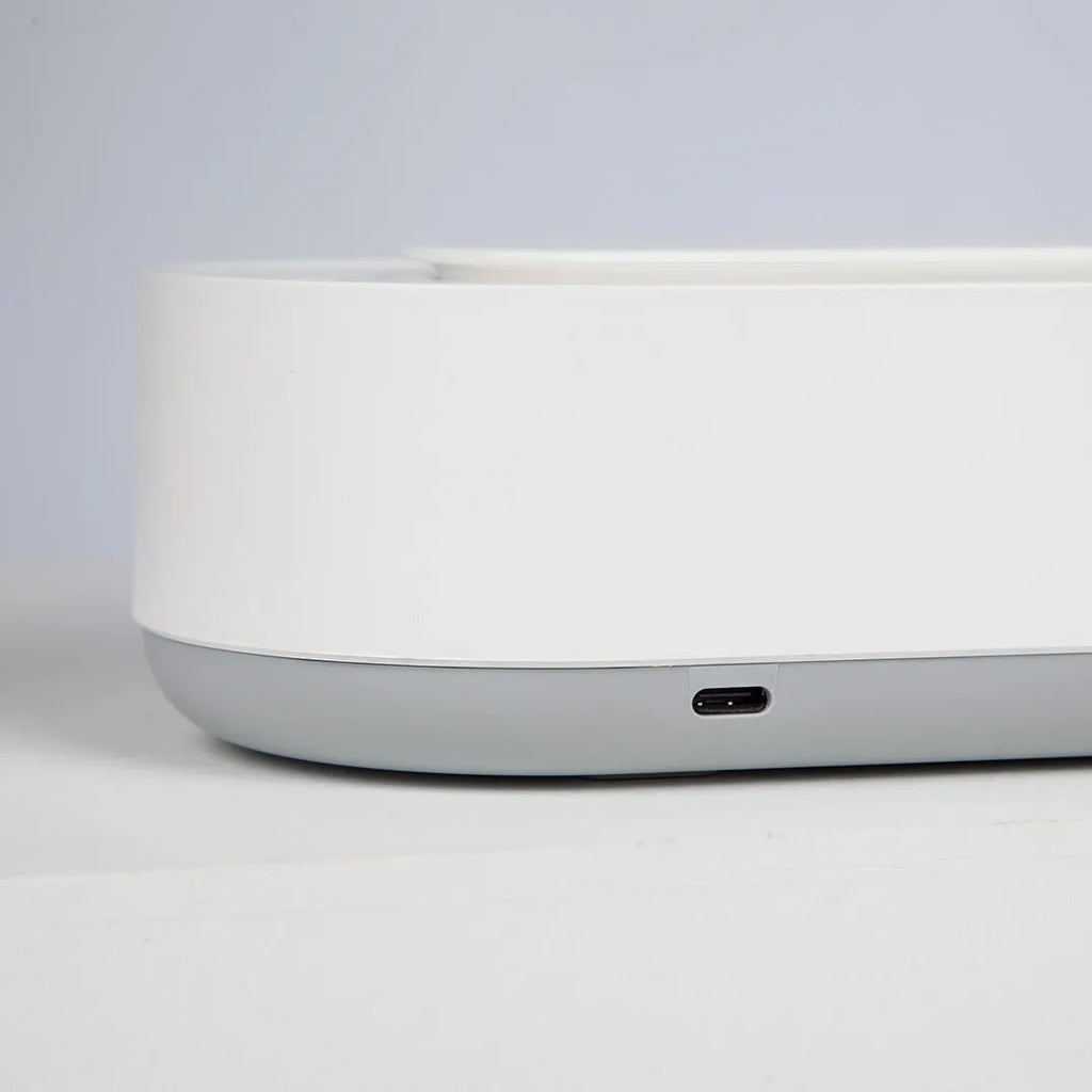 White portable ultrasonic cleaning machine with a stainless steel tank for jewellery and glasses.
