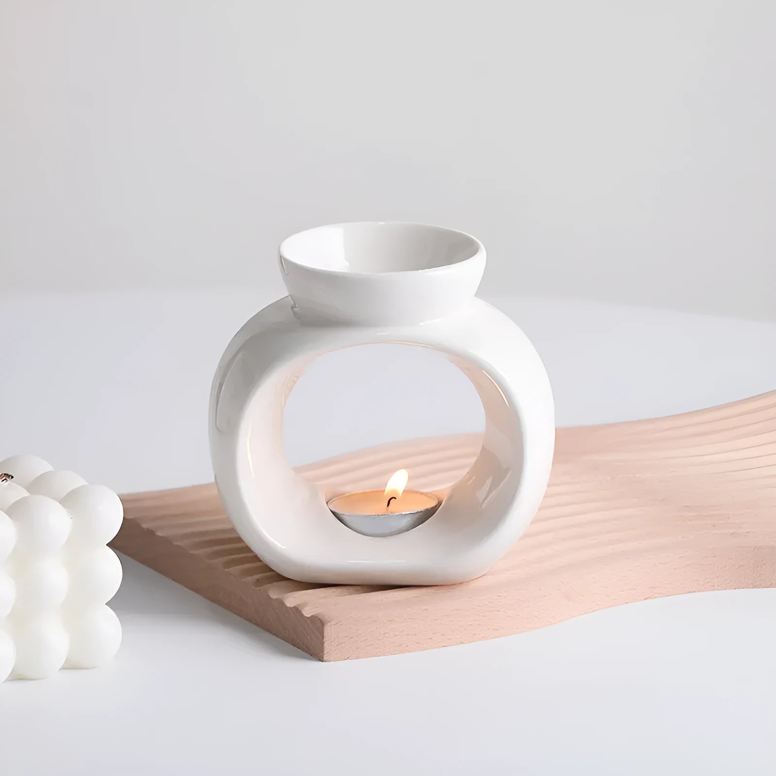 White ceramic Nordic style aromatherapy stove ornament with retro domestic design on tabletop