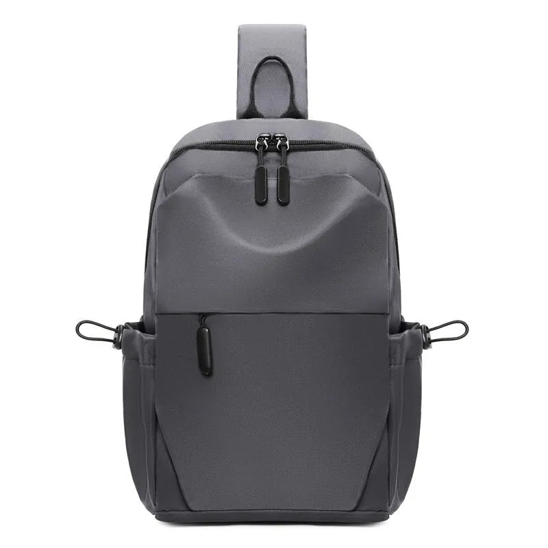 Men's grey waterproof chest bag showing front view with shoulder strap and large main compartment.