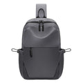 Men's grey waterproof chest bag showing front view with shoulder strap and large main compartment.
