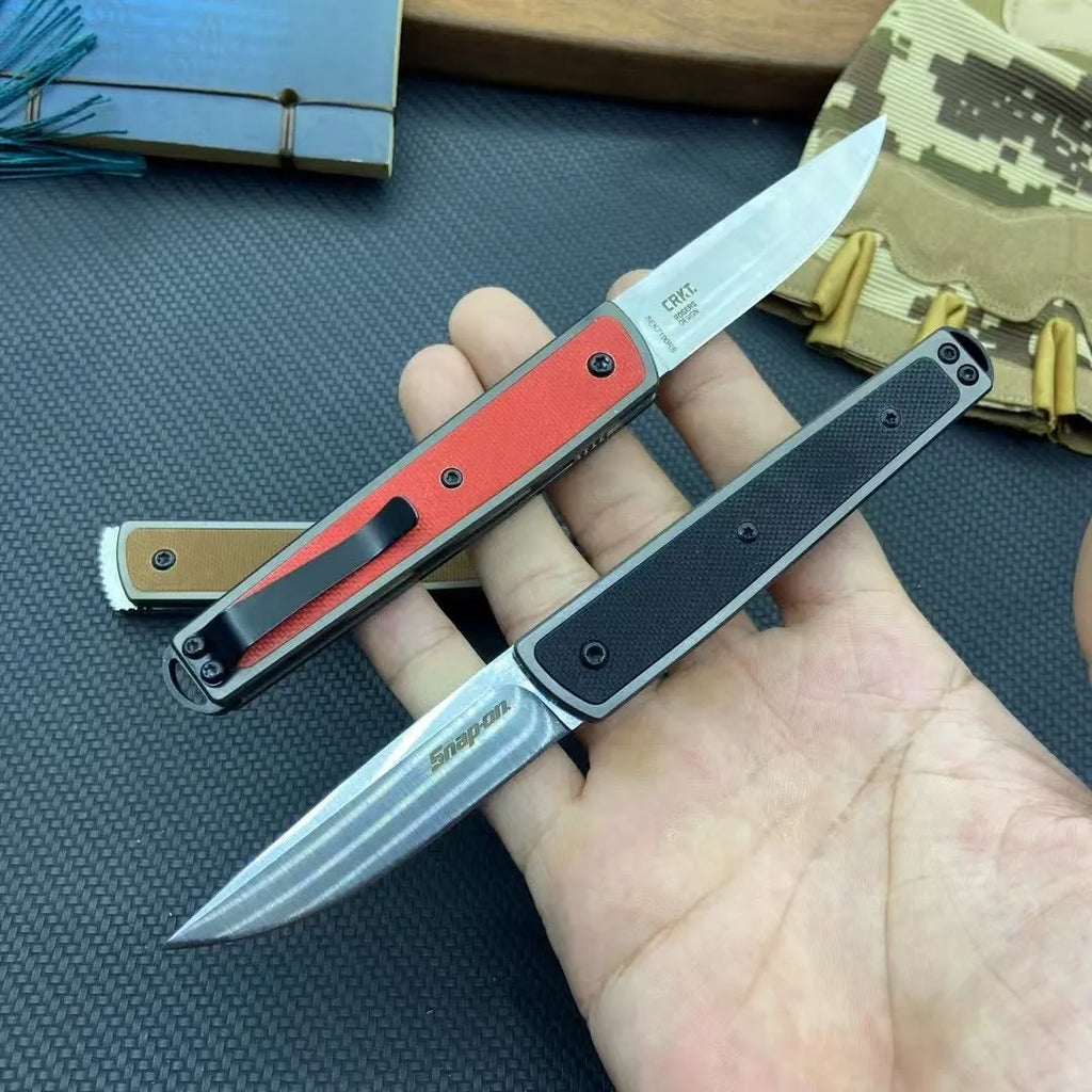 Folding fruit knife with stainless steel blade in black, brown, or red handle colours