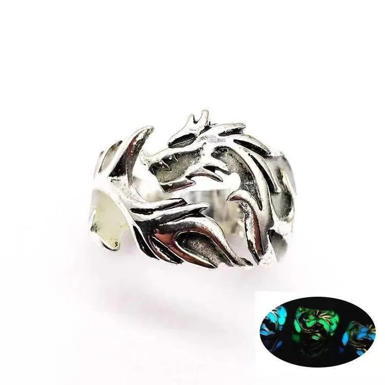 Close-up of an adjustable Chinese dragon pattern ring in antique silver, blue, and green colours.