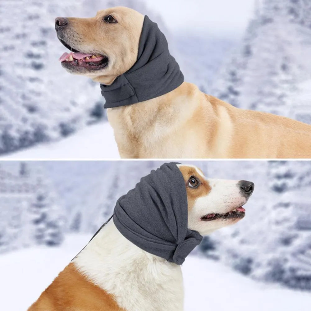 Dog wearing black calming hoodie head cover with ear wrap for noise reduction