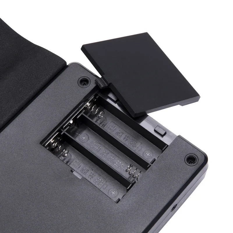 Portable folding electronic keyboard with roll-up silicone keys and ABS control panel in black, silver, or white.