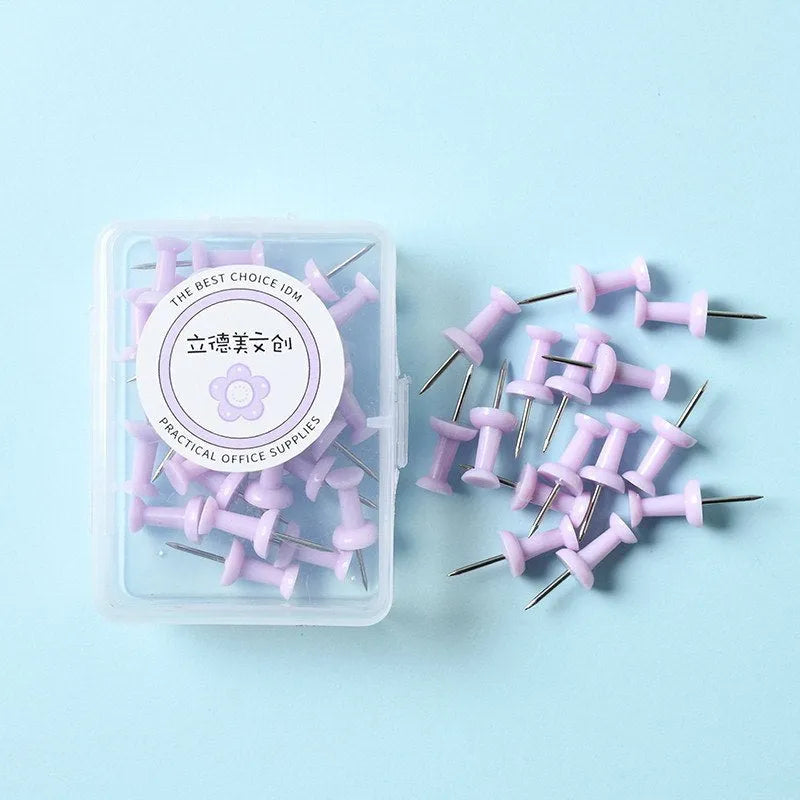 Plastic push pins in cherry blossom pink, mint green, and lavender, showing large and small sizes in a box.
