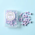 Plastic push pins in cherry blossom pink, mint green, and lavender, showing large and small sizes in a box.