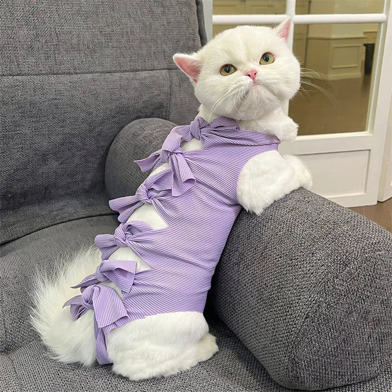 Adjustable lace-up cat sterilisation recovery suit in polyester, shown in various colours.