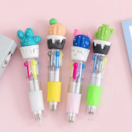 Cartoon print press ballpoint pen showing four-colour design options including cactus, fast food, and heart wings.