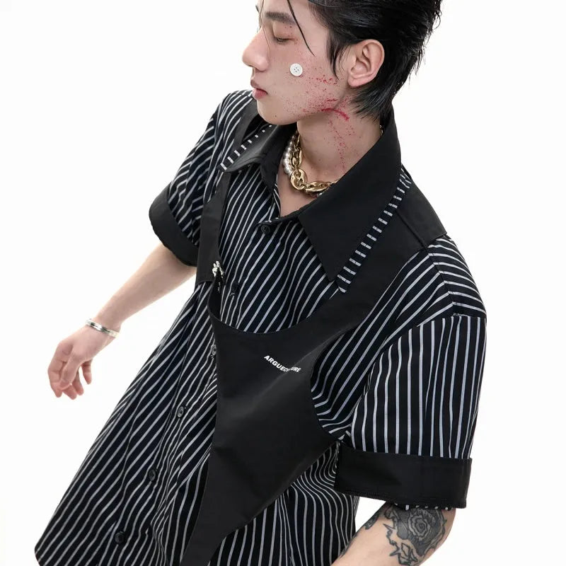 Man wearing a black and white striped cotton shirt with a distinctive double lapel collar design.