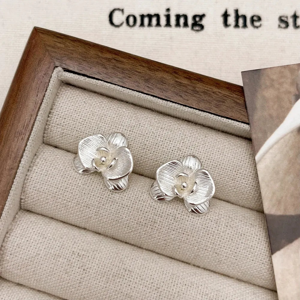Retro flower earrings with petal detailing in gold or silver electroplated finish on copper