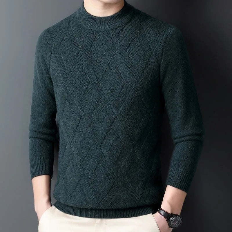 Man wearing a thick grey diamond jacquard knit pullover sweater.