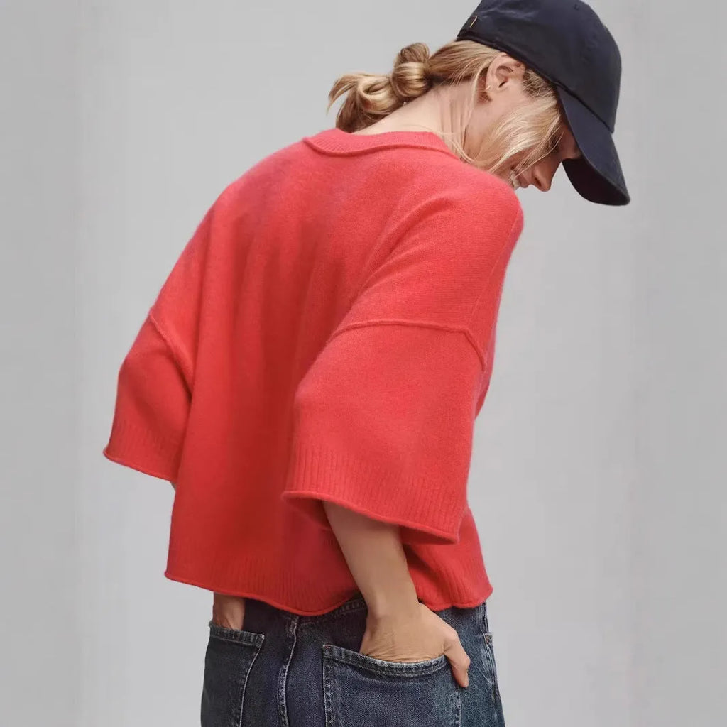 Red hot girl style viscose t-shirt with short sleeves and an exposed navel cut on a mannequin.