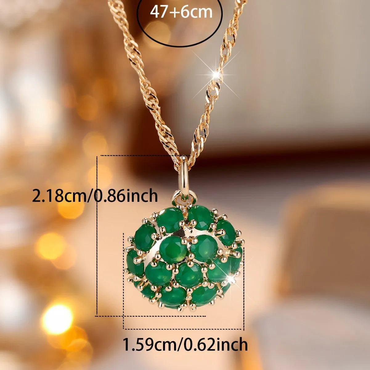Geometric copper pendant necklace with round emerald and diamonds on an adjustable chain in champagne gold.