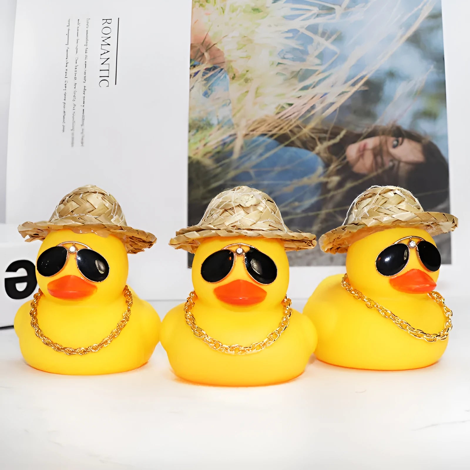 Yellow cartoon Straw Hat Duck car dashboard ornament with matte finish on a car interior.