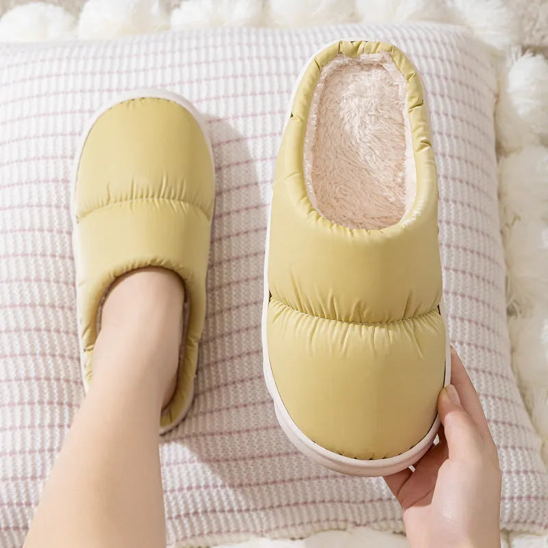 Down cotton couple slippers with artificial leather upper and non-slip rubber soles in multiple colour options