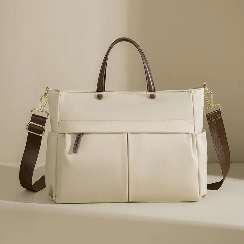 Women's Oxford cloth laptop bag with open pockets showing elegant black and nuts apricots colour options