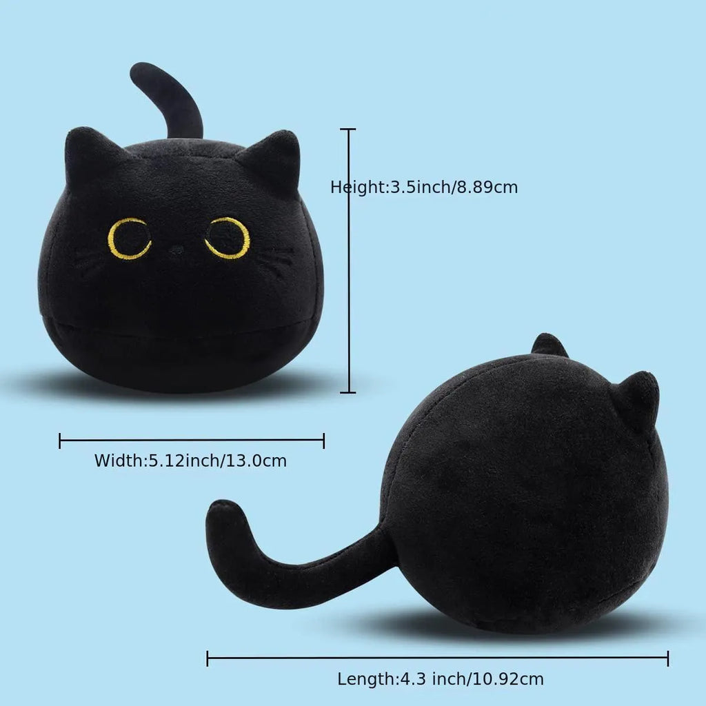 Black fluffy cat plush toy with printed face, sitting upright as a soft cushion.