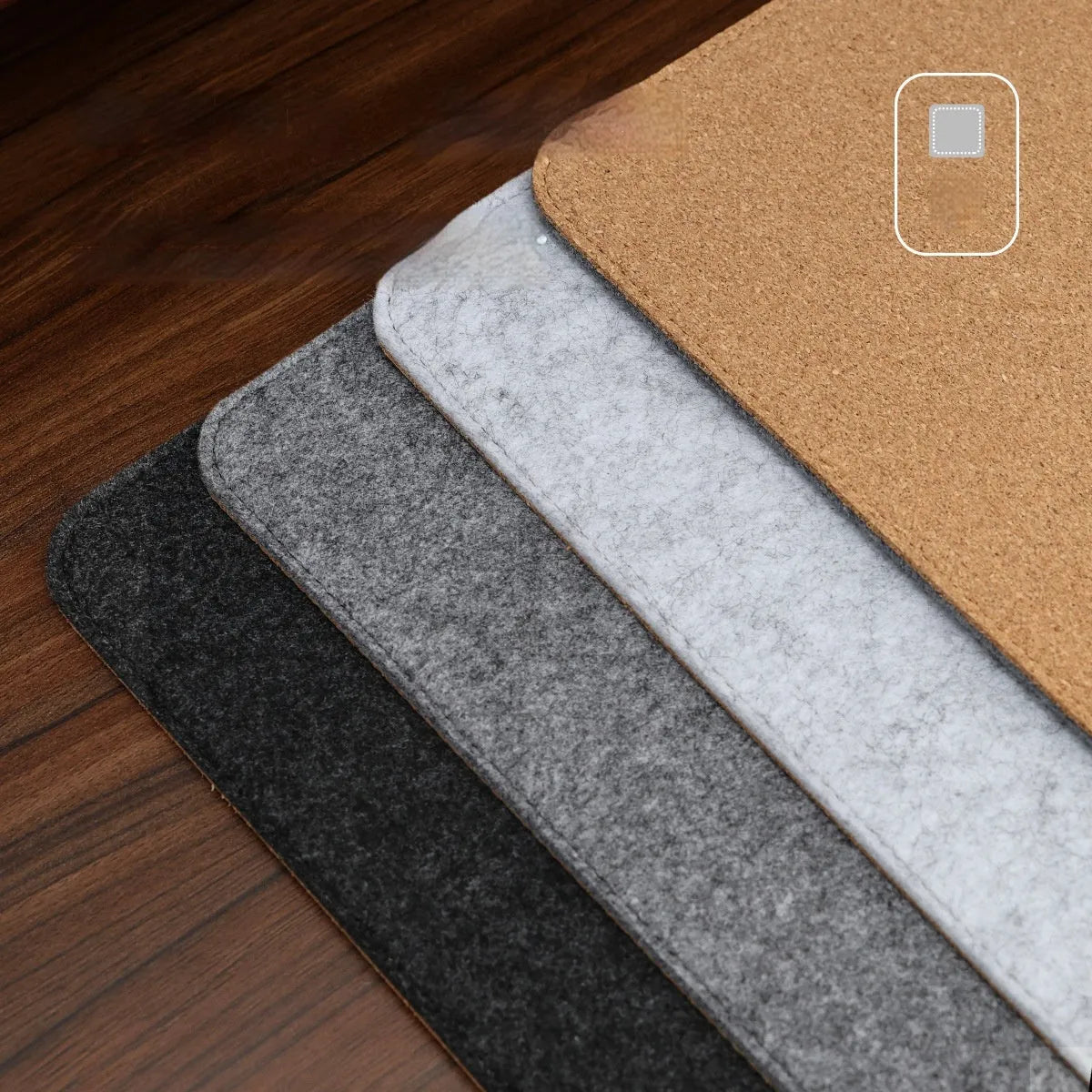 Oversized grey felt cork desk mat with minimalist design on a wooden desk