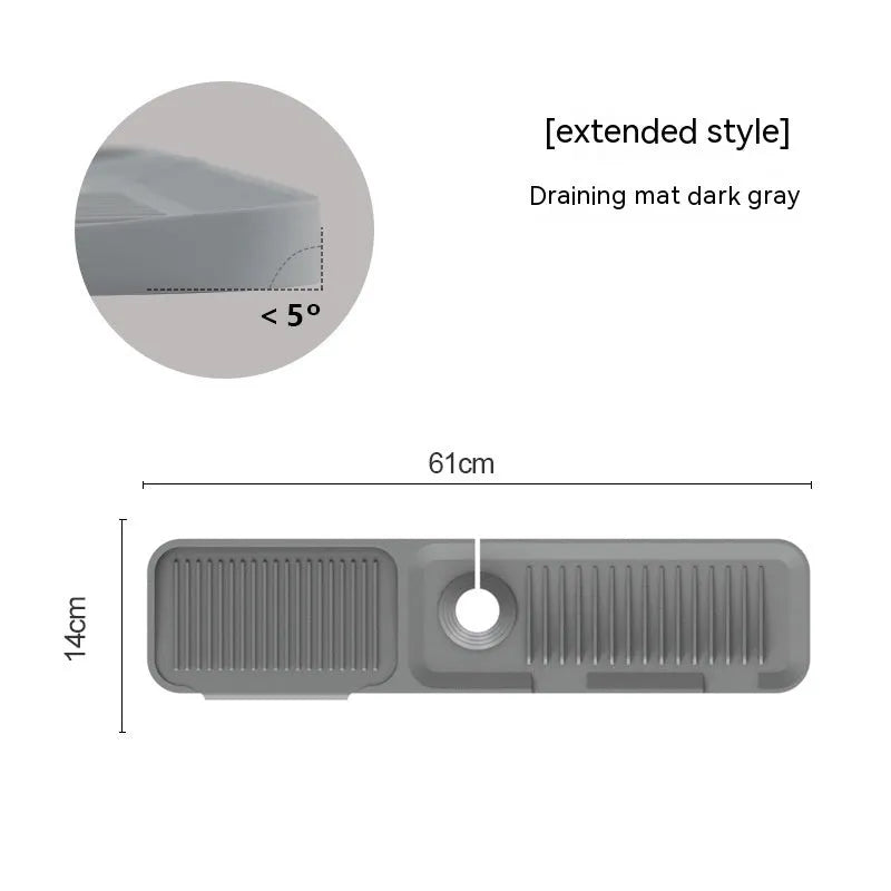 Silicone faucet splash guard pad in sloped design with drain channels on kitchen sink