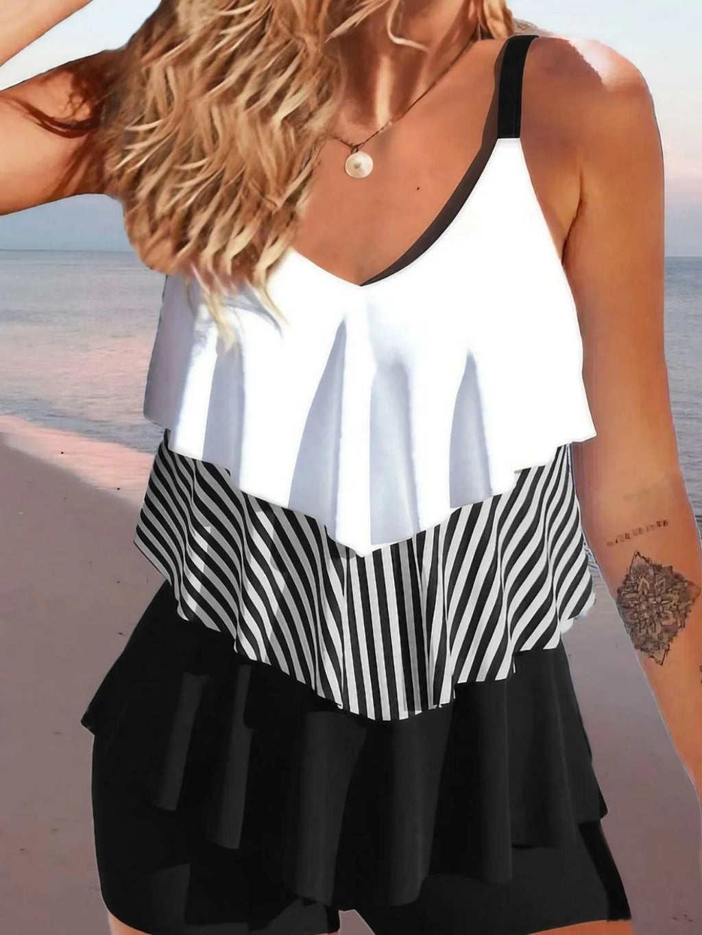 Women's sleeveless backless spaghetti-strap bikini with ruffled split-side briefs in a floral print.