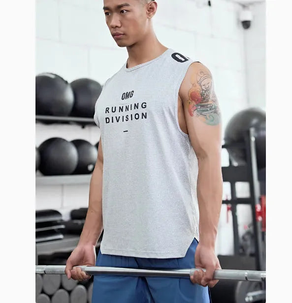 Man wearing a lightweight grey mesh sports vest, showing loose fit and breathable fabric for exercise.