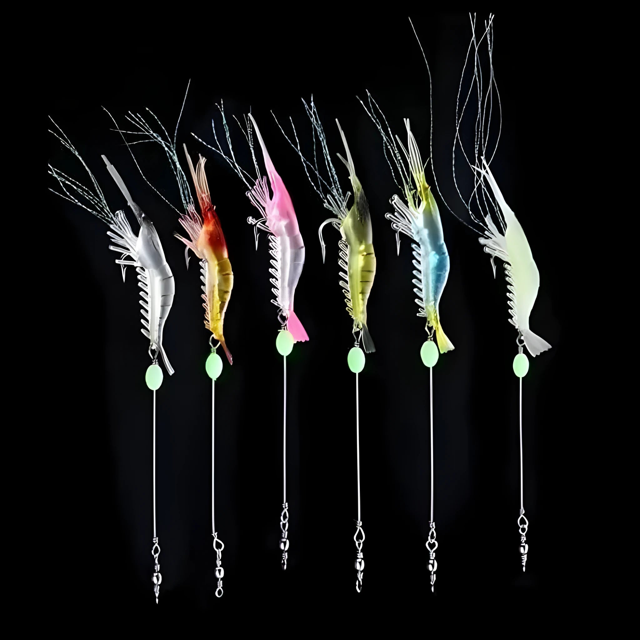 Six soft plastic fishing lures with integrated hooks in different colour variations including luminous patterns