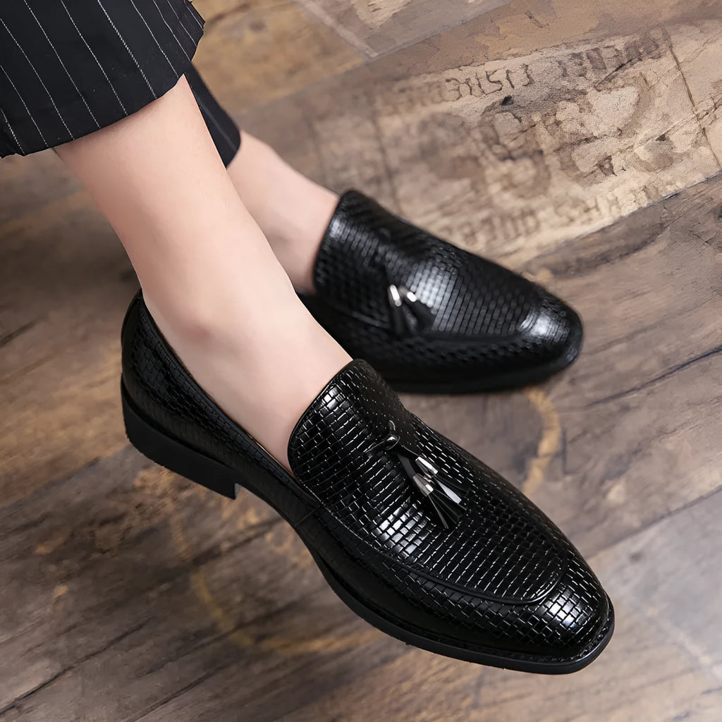 Men's black pointed toe slip-on business shoes with decorative tassel on artificial PU upper