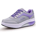 Women's grey powder mid-heel heelless travel and sports shoes on a white background.